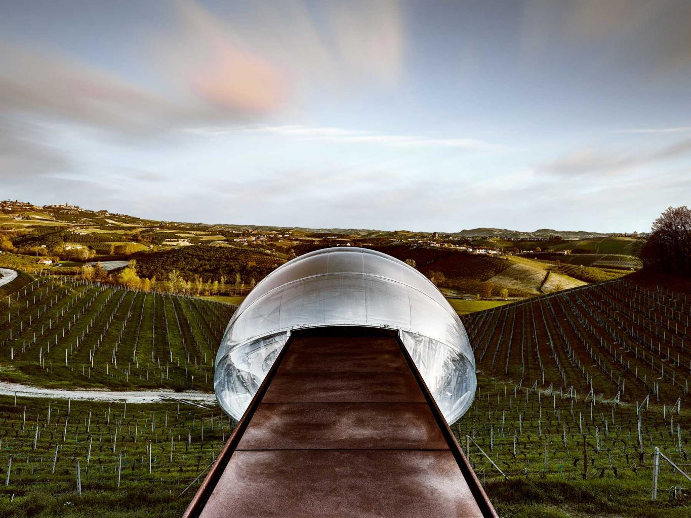 the acino (grape), is a clear bubble hanging over the countryside of Langa, showing the past and future of the winery